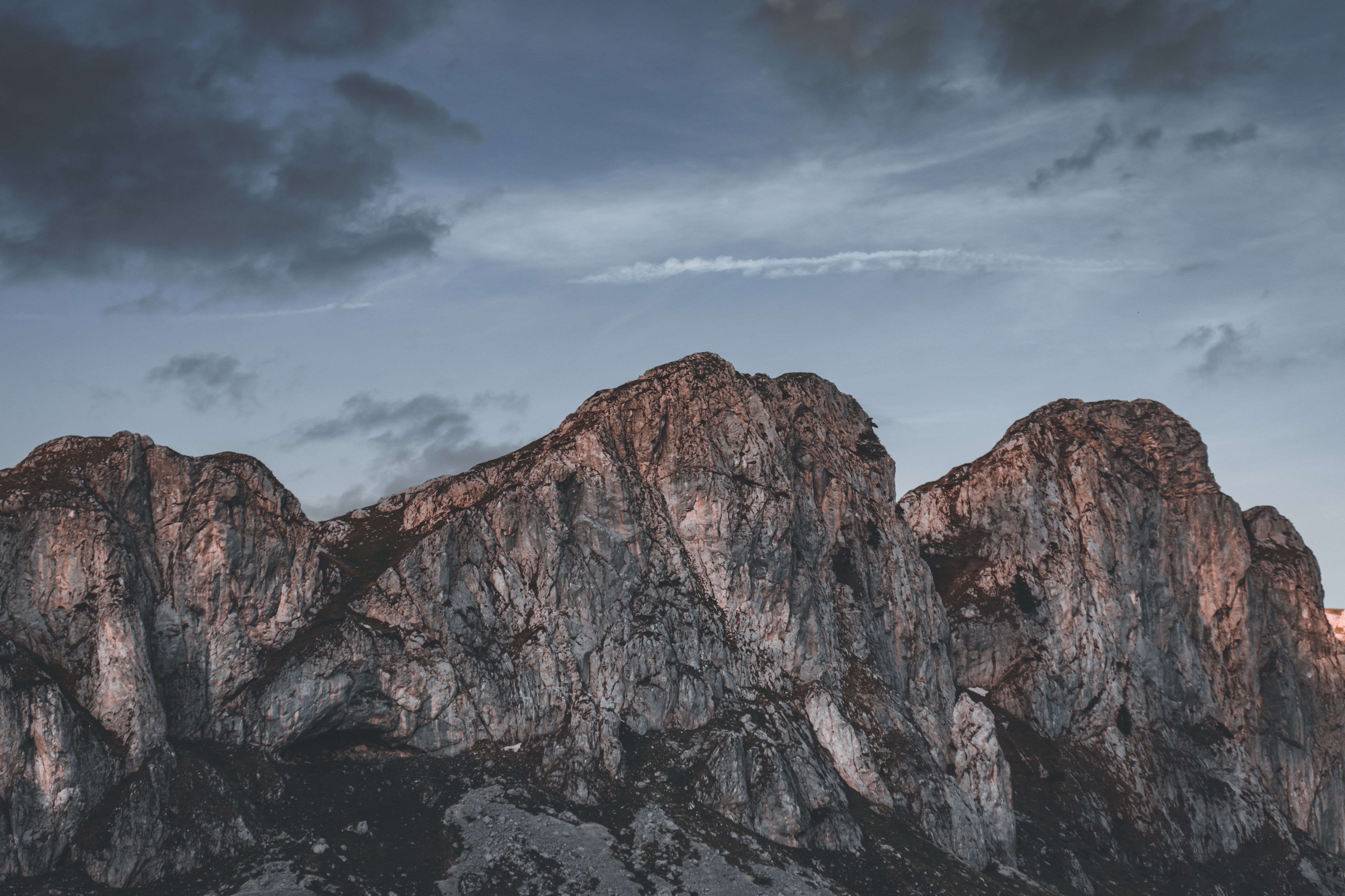 Brown Rocky Mountain Under Cloudy Sky · Free Stock Photo