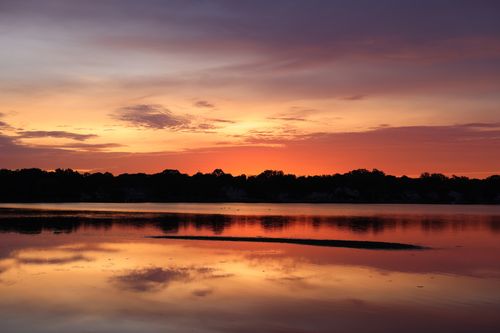 Free Experience the tranquil beauty of Stamford's lake at sunset with vibrant skies and calm waters. Stock Photo