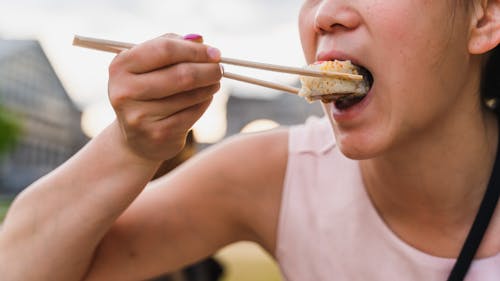 Woman Eating Japanese Food