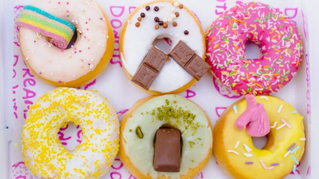 Brown and Pink Doughnut on White and Pink Floral Ceramic Plate