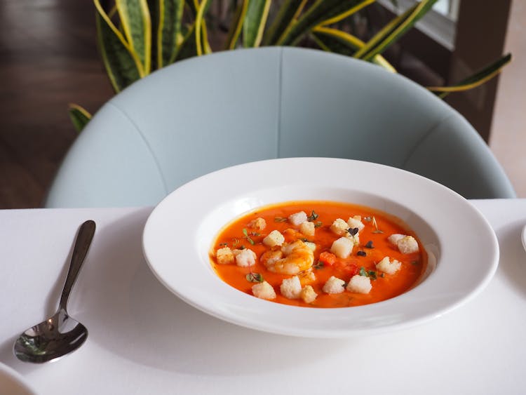 Bowl Of Soup With Shrimp And Croutons