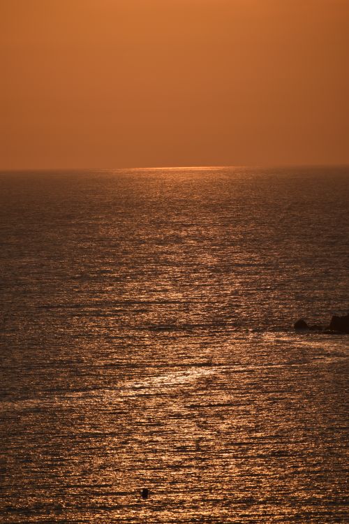Free A breathtaking sunset casting warm hues over the Adriatic Sea near Saranda, Albania. Stock Photo