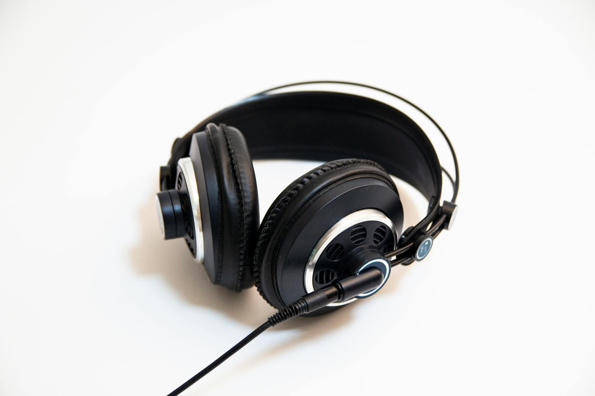 Close-up of professional wired headphones on a clean white background for audio enthusiasts.