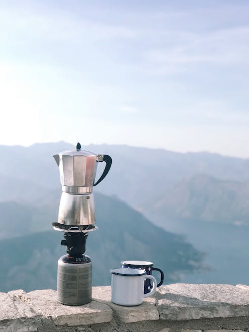 Free Morning Coffee from Moka Pot with Mountain View Stock Photo
