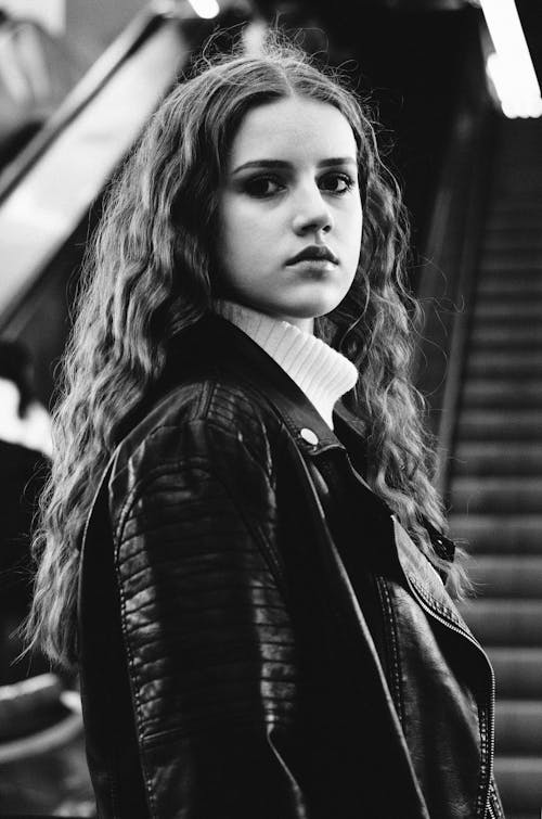 Free A Grayscale Photo of a Woman in Black Leather Jacket Stock Photo
