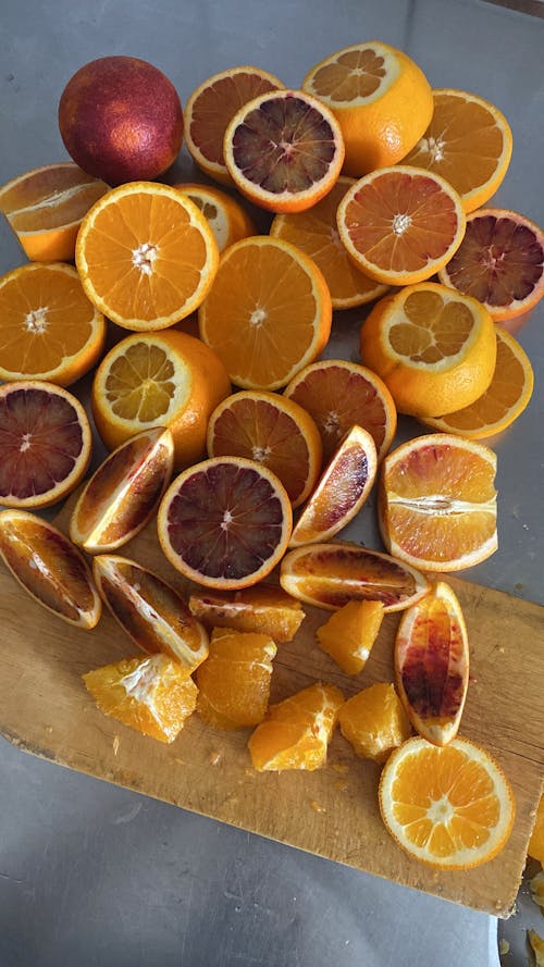 Sliced Orange Fruits on Wooden Chopping Board