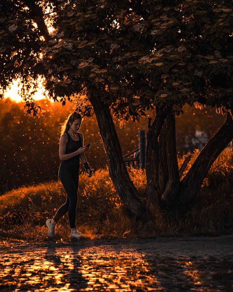 A Woman In Active Wear Jogging 