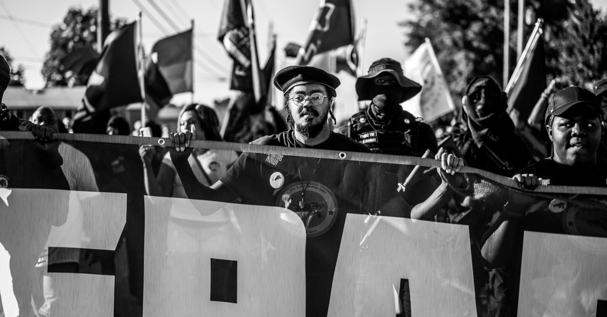 Political Rally Gray Color Grayscale Photo of Men Holding a Rally · Free Stock Photo