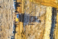 Heavy Machinery Paving the Ground