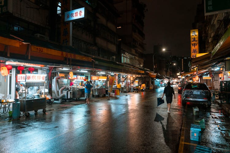 Photo Of A Street With Street Food At Night