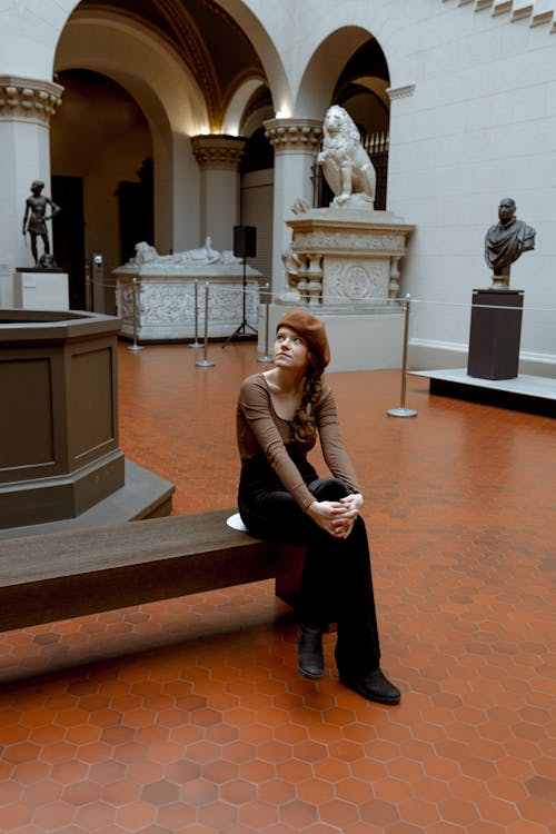 A Woman Looking at Arts Exhibits in the Museum