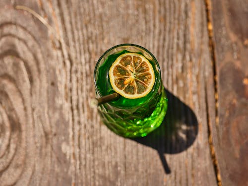 Free Green Cocktail Drink on a Wooden Surface Stock Photo