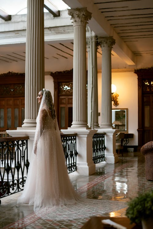 Bride Standing in a Luxury Interior with Columns