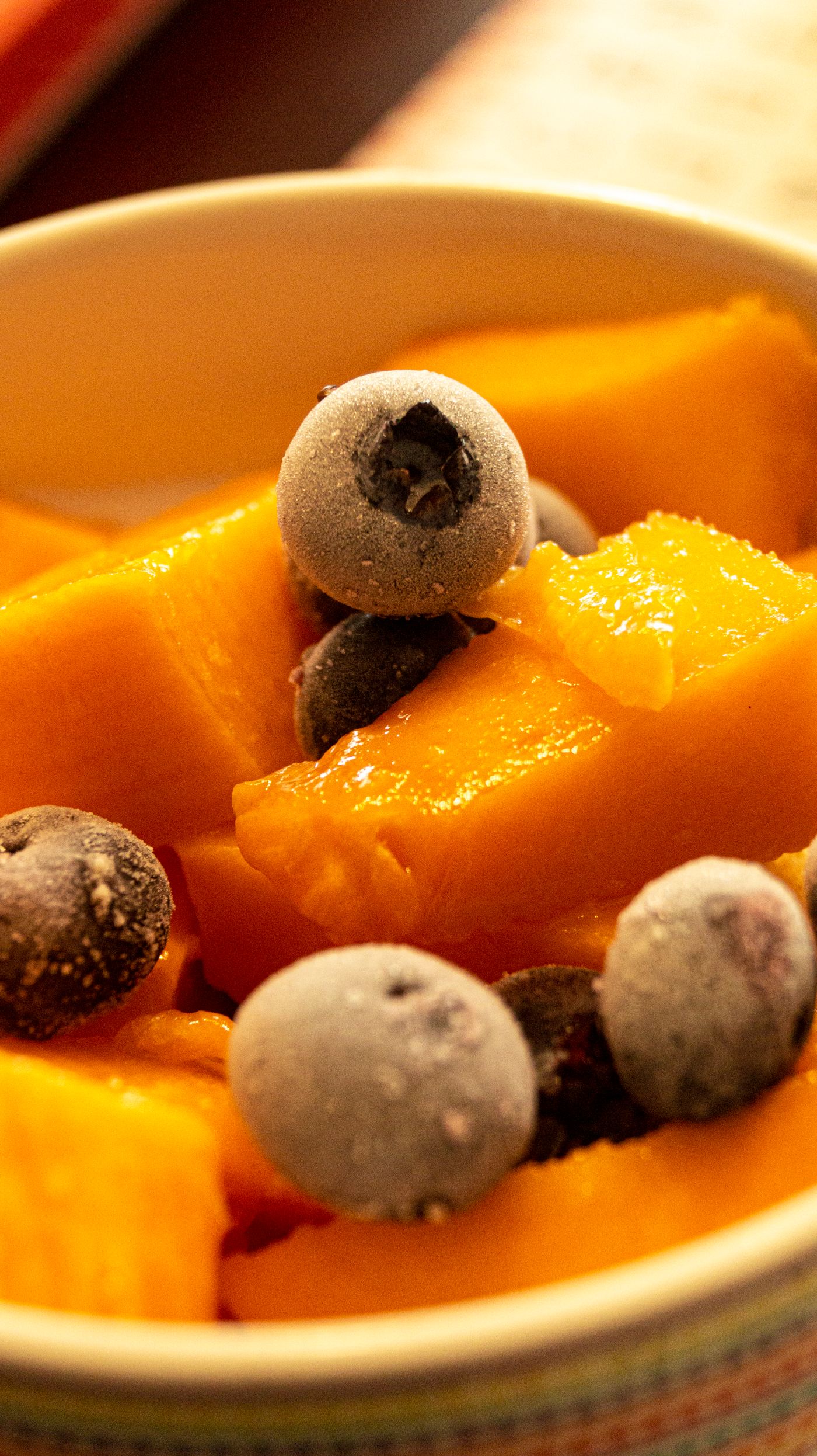 Bowl of frozen berries and mango