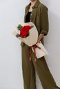 Woman in Brown Coat Holding Bouquet of Red Roses