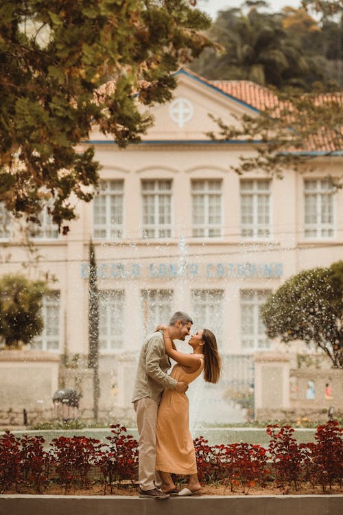 Couple Embracing by Fountain