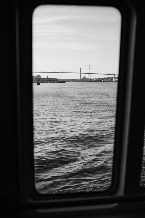Free View from Ferry Window on Bridge in Bay Stock Photo