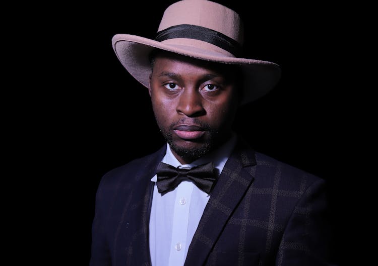 Man In Suit Jacket With Ribbon And Hat 