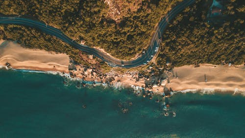 Aerial View of an Asphalt Road Near the Ocean