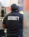 Security guard in uniform patrolling in a commercial area. fpsecurity.ca