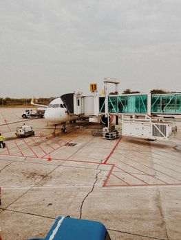 Aircraft at gate with boarding bridge at Barranquilla airport, Colombia.