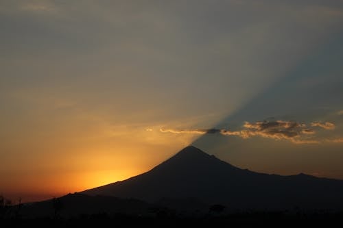Silhouette of Mountain During Sunset