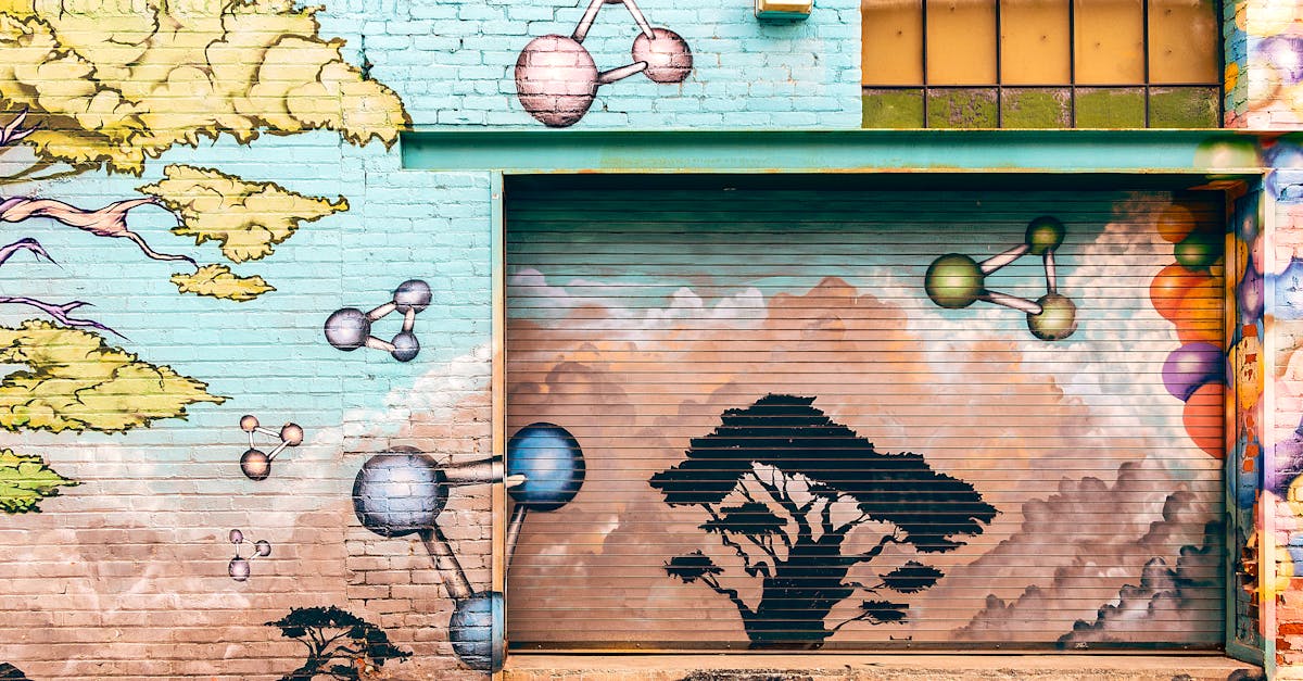 Colorful mural on a brick wall in Pasadena featuring trees and molecular shapes.