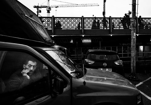 Free Black and white image of a thoughtful driver in Istanbul, capturing urban life. Stock Photo