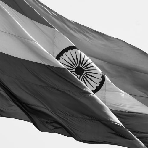 Free Black and white photo of the Indian national flag waving gracefully, symbolizing patriotism. Stock Photo