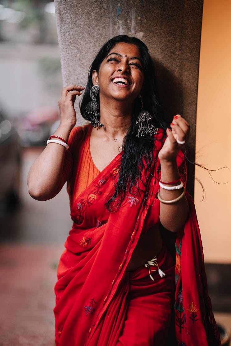 Portrait Joyful Woman In A Red Sari 