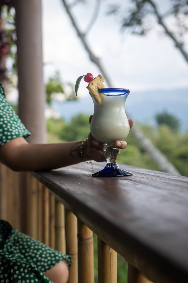 Person Holding A Cocktail Drink