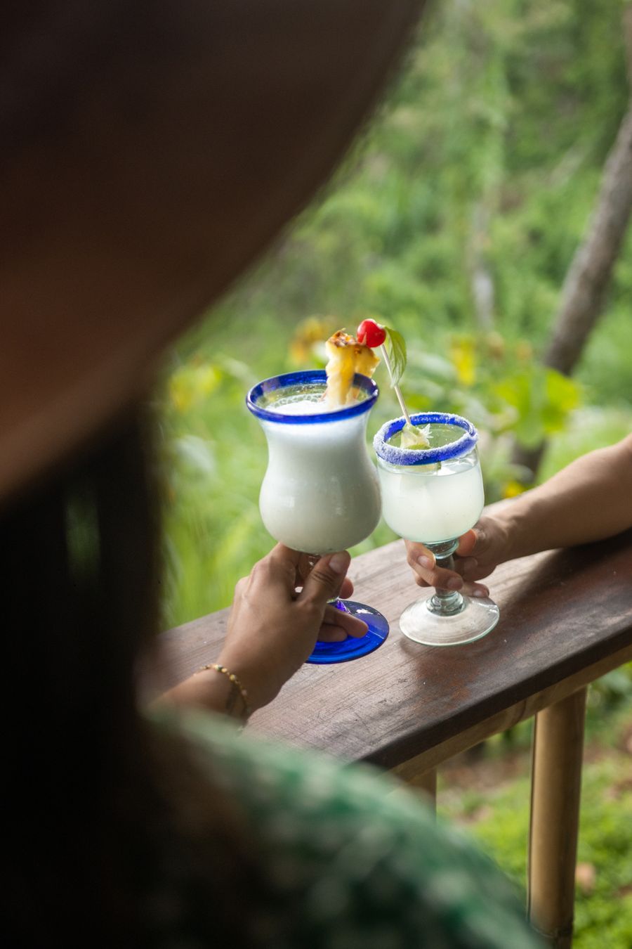 Guests making a tropical toast at an island-themed celebration