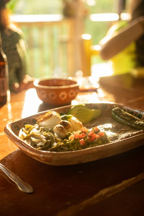 Free A vibrant and authentic Mexican dish served on a ceramic plate in warm sunlight. Stock Photo
