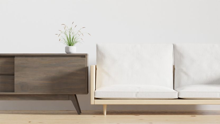 Pale minimal living room with a walnut console and linen sofa — photo by dada _design on Pexels