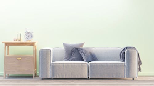 Gray Couch Beside a Wooden Side Table