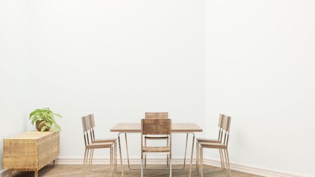 Simple dining room setup featuring wooden table and chairs with a potted plant for decoration.