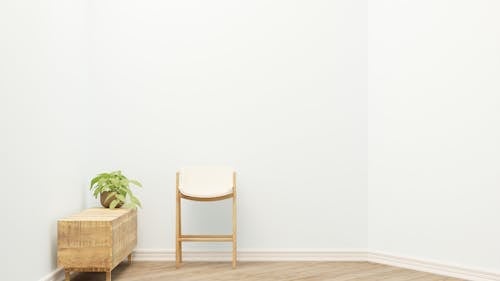 Brown Wooden Chair Beside Green Plant