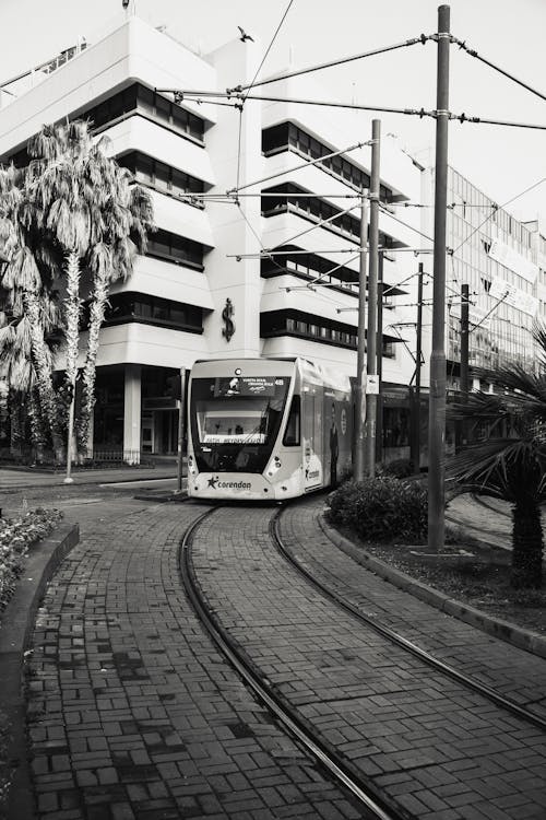 Grayscale Photo of a Train on the Tramway