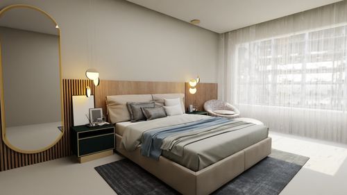 Free Stylish bedroom featuring cozy decor with a minimalist touch, highlighted by large windows and sleek furniture. Stock Photo