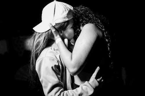 Grayscale Photo of Couple Kissing