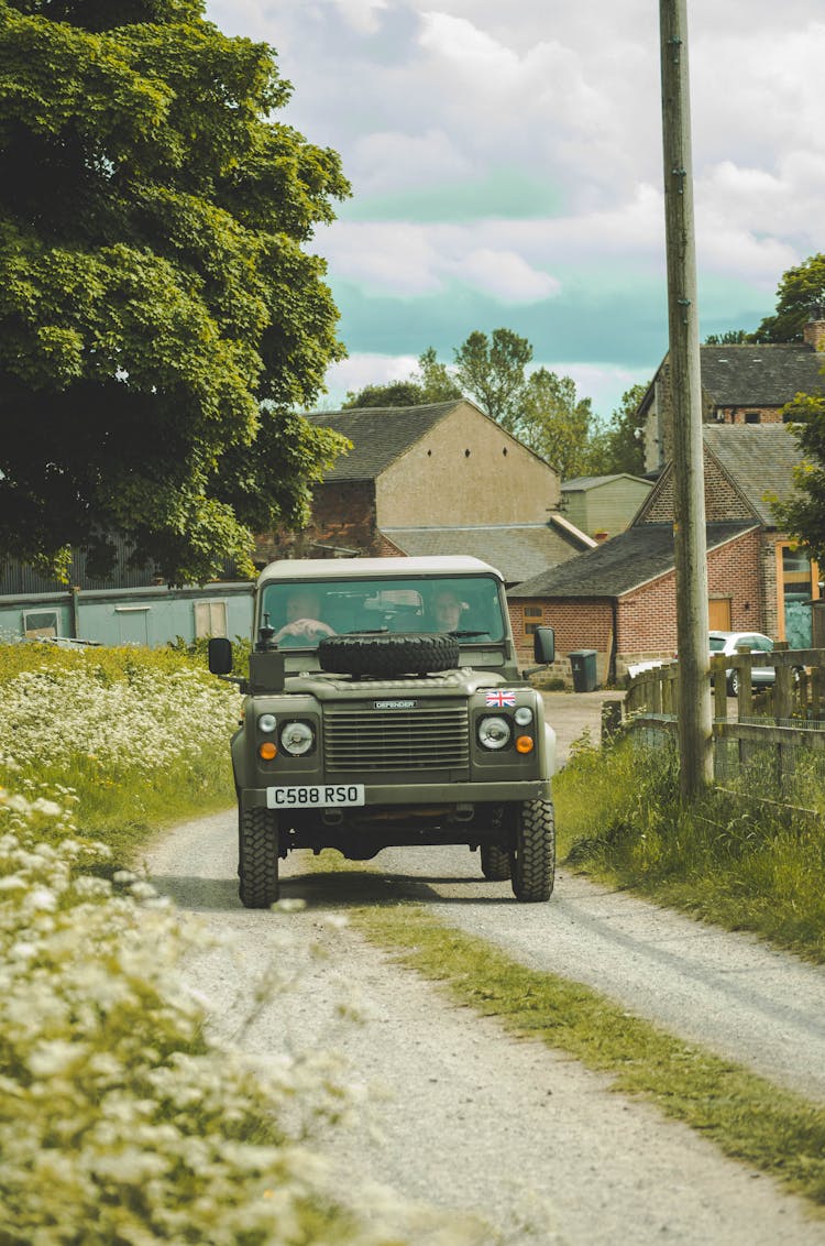 Jeep Driving On Unpaved Road