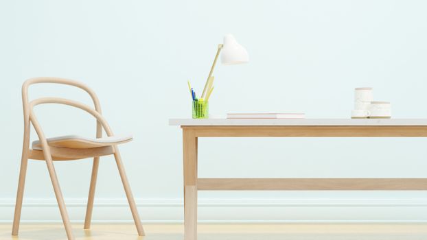 A minimalist office space featuring a wooden chair and desk, with a white lampshade and stationery.