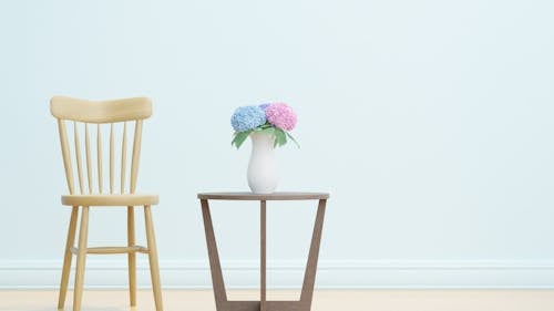 Ceramic Vase on the Center Table Beside Wooden Chair