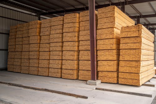 Pile of Wood Planks inside a Warehouse