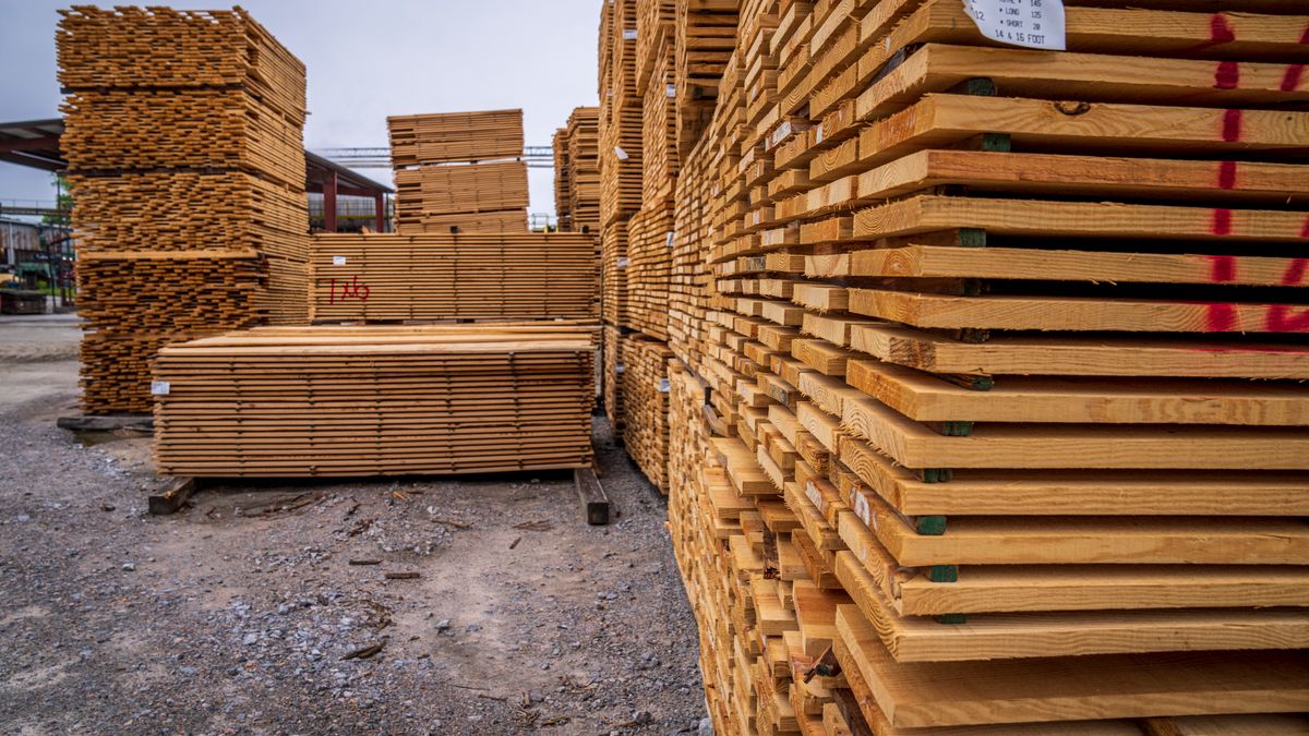 Stacks of boards at a lumber yard. Softwood is sold by the piece; hardwood by the board foot.