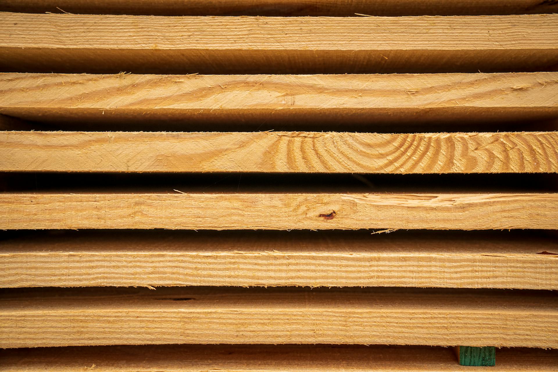 Close-up view of stacked hardwood planks ready for carpentry or construction use.