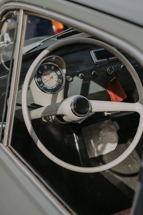 Close-Up Shot of a White Steering Wheel