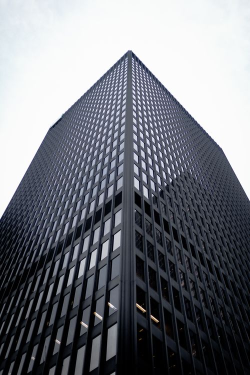 Free A modern skyscraper captured from below, showcasing its architectural design in Toronto, Canada. Stock Photo