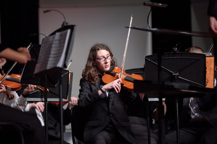 People Playing Violins