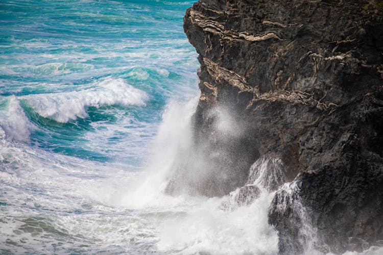 Waves Crashing On A Rock